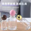 Botella de perfume de vidrio transparente en stock, venta directa, con tapa de bola, botella vacía rellenable de prensa-spray cosmético portátil