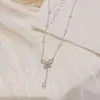 Collar de Cadena para Clavícula con Borla de Perlas y Lazo Hueco Estilo de Lujo Ligero Nicho Sensación de Alta Gama Elegante Suave Versátil