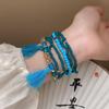 Pulsera de cuentas de arroz coloridas estilo chino nuevo con campana, pulsera de cuerda trenzada artística retro, pulsera de estilo étnico que combina con todo para mujer