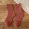 Calcetines de rizo para hombre y mujer calcetines de invierno engrosados de longitud media calcetines de anillo de lana calcetines de mujer color liso calcetines cálidos de toalla venta al por mayor