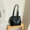 Bolso Cuadrado Pequeño de Mano Color Liso Estilo Coreano para Mujer Nuevo Otoño Temprano 2026 Elegante Temperamento Moderno Simple Alto Valor Bolso de Hombro Único