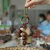 Cascabel Campana de Mano Carrillón Colgante de Bolsa Hecho a Mano Rayo de Sonido Cascabel Colgante Fruta Negra Indonesia Cáscara Fábrica Venta al por Mayor