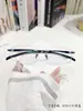 Nuevo modelo de montura de gafas de aleación TR ultraligera con borde cortado, montura de gafas elegante para miopía y presbicia, montura de gafas para hombre E50