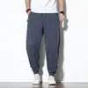 Pantalones Harem Casuales de Lino para Hombre Estilo Chino Otoño 2021 Rayas Retro Combinación de Colores Sueltos Algodón y Lino Botón de Disco