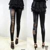 Pantalones de lápiz de nueve puntos asimétricos de un solo lado de cuero sintético europeo y americano para primavera y otoño, leggings ajustados ajustados de cuero sintético mate
