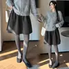 Nova saia casual de lã com design outono/inverno para mulheres, cintura elástica, saia de botão de flor, saia de lã
