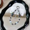 Correa de cadena para teléfono con cuentas de cristal, colgante de estrella colorida del cielo estrellado, cadena para colgar el teléfono, accesorio popular para bolso, pequeño regalo