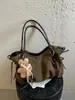 Nova bolsa tote com glitter de estrela de design de nicho 2026, bolsa de ombro para o dia a dia, bolsa de mão versátil, bolsa de ombro, bolsa transversal para mulheres