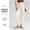 Calças de yoga com sensação de segunda pele para levantar o bumbum com efeito bumbum de pêssego, bolsos, alta elasticidade, sem costura, secagem rápida para corrida e yoga para mulheres atacado