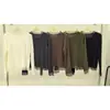 Top de punto de manga larga con cuello de encaje de malla de color liso y dobladillo de gasa, estilo suave, top interior ajustado para mujer de principios de otoño