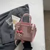 Bolso de mujer de nicho de alta gama 2026 nuevo bolso cruzado de moda a cuadros estilo coreano moderno bolso tipo cubo
