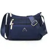 Bolsa de tela de nailon ligera repelente al agua, bolsa cruzada casual para el día a día, nuevo estilo, bolsa simple tipo bollo, moderna bolsa de hombro para mujer