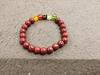 Venta al por mayor de fábrica pulsera de un solo círculo imitación cinabrio étnico hebilla de paz valiente colgante de múltiples estilos pulsera de cinabrio exquisita