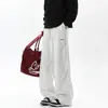 Pantalones de chándal pesados color gris claro para hombre 2025 Otoño Nuevos Pantalones deportivos holgados versátiles casuales de pierna ancha