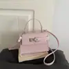 Otoño/Invierno 2026 Nuevo Elegante Textura de Moda Versátil Ligero de Lujo con Relieve de Cocodrilo Bolso Kelly de Hombro Cruzado de Mano