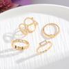 Europa y Estados Unidos transfronterizo nuevo juego de anillos geométricos para mujer retro nicho simple hueco retorcido anillo de 4 piezas al por mayor
