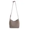 Bolso tipo bandolera cubo simple casual estilo coreano para mujer 2025 Invierno Nuevo Textura de alta gama Estilo extranjero Bolso de un solo hombro cruzado