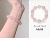 Pulsera bicolor de cristal azul natural y cristal rosa con diseño de oso y rosa, una pulsera blanca de lujo ligero y estilo antiguo fresco.
