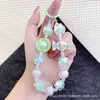 Bolsa de Moda Romántica de Gatito de Caramelo Colorido Llavero Colgante Super Hada Cristal Lanyard para Teléfono Colgante de Perlas