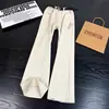Jeans de algodón puro bordados color blanco roto cleanfit para hombre corte diagonal americano pierna curva pantalones high street pierna recta pantalones ligeramente acampanados