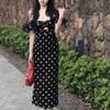 Vestido de un hombro estilo Hepburn suave elegante que cubre la cintura y la cadera falda larga retro francés negro hueco lunares