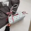 Bolsa de ombro com laço única e sofisticada para mulheres, nova bolsa baguette estampada, bolsa de ombro moderna, fresca e doce