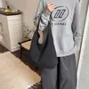 Nuevo Estilo de Principios de Otoño Alta Apariencia Retro Nicho Relajado Rayas Letras Bolso Tote Ligero para Viajar Cruzado Diseño Simple