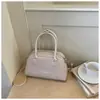 Bolso tipo bowling tejido retro moderno de lujo ligero, gran capacidad, bolso de mano casual francés 2026, bolso de hombro y cruzado para mujer