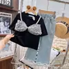 Nueva moda en ropa infantil para niñas: conjunto de top con lazo de lunares y pantalones de mezclilla, atuendo elegante de dos piezas para niñas