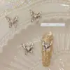 Joyería de uñas nueva de网红 aleación mariposa líquida mariposa plateada estéreo cuadrado de diamante decoración de uñas de diamante al por mayor