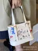 Bolsas de Nicho de Alta Gama para Mujer 2025 Nueva Moda Tendencia Versátil Bolso de Hombro Cruzado Bolso Cubo de Mano de Lujo Ligero