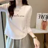 Camiseta de algodón acanalado de manga larga para mujer, nuevo estilo primavera/otoño, corte ajustado, diseño único, dobladillo curvo irregular, top de moda