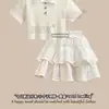 Roupas de Verão para Crianças Grandes Novidade Moda Feminina Estilo Elegante e Gentil Camiseta de Manga Curta com Gola Polo Conjunto de Duas Peças com Saia de Bolo Fofa
