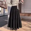 Falda tipo umbrella casual de estilo coreano para principios de otoño, que cubre la cadera, adelgazante, para mujer, falda larga, falda de capas abullonada, negra