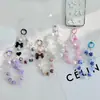 Corrente de Celular Feita à Mão com Contas Estilo Blind Box Tema Dopamina com Três Cordões e Pingente de Boneca Pintado à Mão