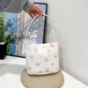 Bolsa feminina casual 2026 novo modelo pequena bolsa de ombro floral estilo coreano bolsa de axila textura vintage bolsa de mão bolsa feminina para o verão