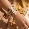 Pulsera de concha tejida con rafia transfronteriza, estilo vacación en la playa, cordón ajustable, accesorio de mano multicolor, al por mayor en stock
