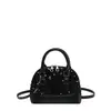 Elegante y estilizado bolso de mano, colección otoño 2026, diseño versátil en forma de concha, moderno bolso cruzado para mujer