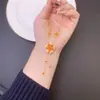 Nuevo diseño de collar vietnamita estilo chino en oro de arena, sensación de gota de aceite, flor de cerezo, doble borla, cadena para la clavícula, joyería de lujo ligero sin decoloración a largo plazo