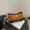Bolso de axila de gamuza de aspecto retro de alta gama para mujer 2025 Nuevo bolso de cadena acolchado de moda Bolso cruzado simple para mujer