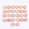 Letra niños alfabetización cuentas molares Haya cuentas redondas 26 letras traje accesorios de madera plano redondo 15mm venta al por mayor