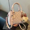 Bolso Boston de color de bloque de lunares de nicho transfronterizo para mujer, nuevo bolso de hombro y cruzado informal con textura para el verano de 2026