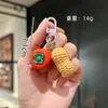 Llavero creativo de caqui personalidad simulación de caqui bolsa de cacahuete colgante pequeño venta al por mayor decoración divertida para coche