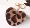 Leopardo europeo y americano amor felpa bola de pelo llavero placa bola de pelo llavero colgante para mujer Regalos Creativos Mayoreo
