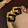 Pendientes de plata esmaltada con hebilla de doble diamante en forma de 8, estilo retro de alta gama, combinables con todo.