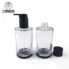 Fornecimento Direto da Fábrica Frasco de Óleo de Limpeza Facial de Vidro Tipo Pump 150ml, Formato Redondo Reto, Frasco de Limpeza Facial para Hotel, Material de Embalagem para Skincare com Ombro Plano