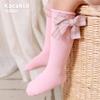 Calcetines de otoño e invierno para niños con lazo de color sólido rojo año nuevo calcetines de tubo calcetines de algodón de viento de princesa para niñas calcetines de baile al por mayor