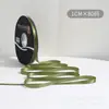 Lazo de regalo de color sólido de 1 cm flor decorativa para envolver material para ramos de cinta de satén venta al por mayor