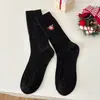 Calcetines de mujer de caña media otoño e invierno patrón de cáñamo calcetines de Navidad bordado de muñeco de nieve moda todo a juego calcetines de felpa Zhuji