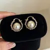 Elegante HerederaEstilo Fresco Bolso de Lunares Plateados Arete Arete Único Mujer 2026 Aretes Súper Hermosos